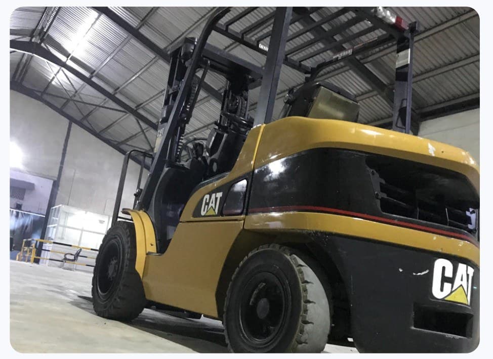 Yellow CAT forklift inside a warehouse